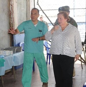 SOTO CANO AIR BASE, Honduras - Dr. Guillermo Saenz, Joint Task Force-Bravo Medical Element, gives Mari Carmen Aponte, U.S. Ambassador to El Salvador, a tour of the Medical Readiness Training Exercise site at Corral de Mulas, El Salvador, Feb. 25.  JTF-B has been conducting MEDRETEs in Central America to provide U.S. military personnel training in delivering medical care in austere conditions, promoting diplomatic relations, and providing humanitarian and civic assistance  since Oct. 1, 1993.  (U.S. Air Force photo/Staff Sgt. Kimberly Rae Moore)