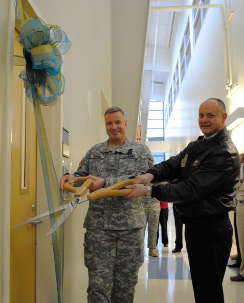 Col. Jerry Penner (L), right, Madigan Healthcare System commander, and Col. Kevin Kilb, 62nd Airlift Wing commander, cut the ribbon on McChord Field’s newest clinic, the Physical Therapy Clinic, Feb. 28 at Joint Base Lewis-McChord, Wash. (U.S. Air Force photo/Capt. Tawny M. Dotson) 