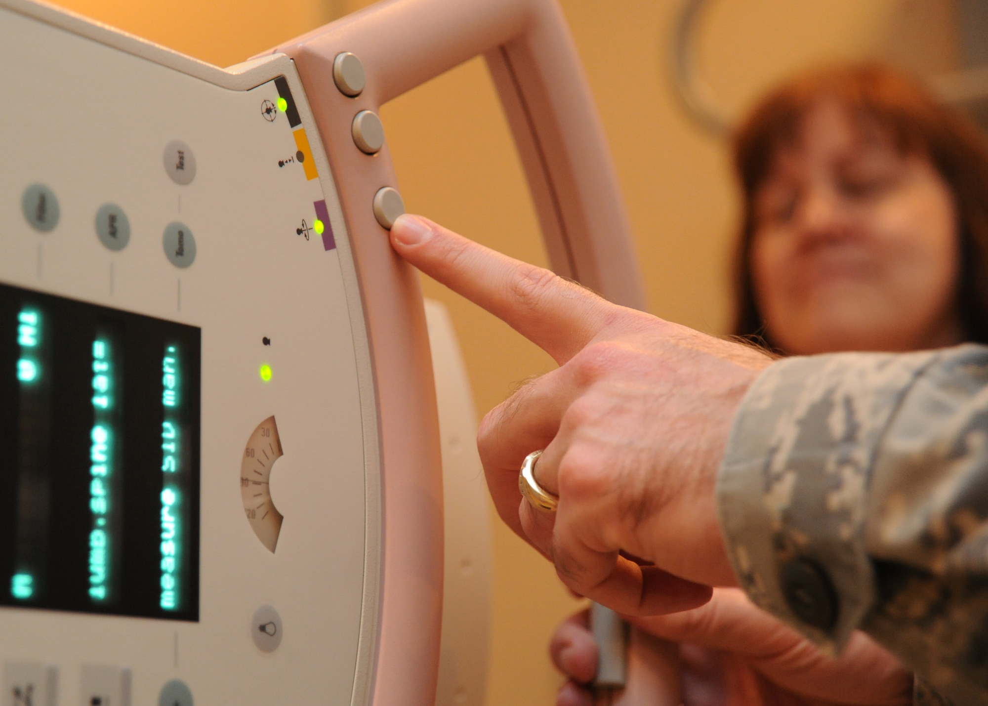 Tech. Sgt. Billy Cole, 22nd Medical Support Squadron Diagnostic Imaging assistant NCOIC, adjusts the settings on an X-ray machine during a routine chest exam Feb. 23, 2011, McConnell Air Force Base, Kan. Air Force Diagnostic Imaging technicians are trained on subspecialties including, radiography, computed tomography, mammography, special training in ultrasound, Magnetic Resonance Imaging or nuclear medicine. (U.S. Air Force photo/Senior Airman Maria A. Ruiz)