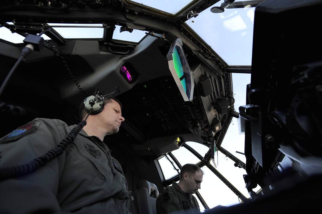 Lt. Col. Michael Watson and Maj. Andrew Jennings go through a startup check list on an EC-130J Commando Solo Feb. 11, 2011, at the Harrisburg International Airport, Pa. Class 1101 is the first group of students to attend mission qualification training for the EC-130J that will replace all the E- and P-model aircraft within the next few years. The EC-130J is equipped with modern avionics and mission systems. It is expected to provide specialized mobility to combatant commanders. Colonel Watson and Major Jennings are Air Force Special Operations Training Center student pilots. (U.S. Air Force photo/Staff Sgt. Julianne M. Showalter) 