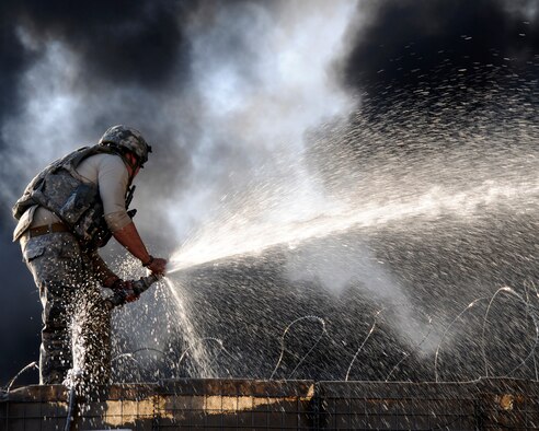 Photos of a mortar and small arms attack by a deployed Airman from the 548th Intelligence, Surveillance and Reconnaissance Group helped base officials assess damage and reinforce battle positions after the attack on the forward operating base in Afghanistan. Provisional Construction Team combat photographer Senior Airman Chanise Epps’ courageous actions earned her the Navy and Marine Corps Achievement Medal and the Army Combat Action Badge.(U.S. Air Force photo/Senior Airman Chanise Epps)