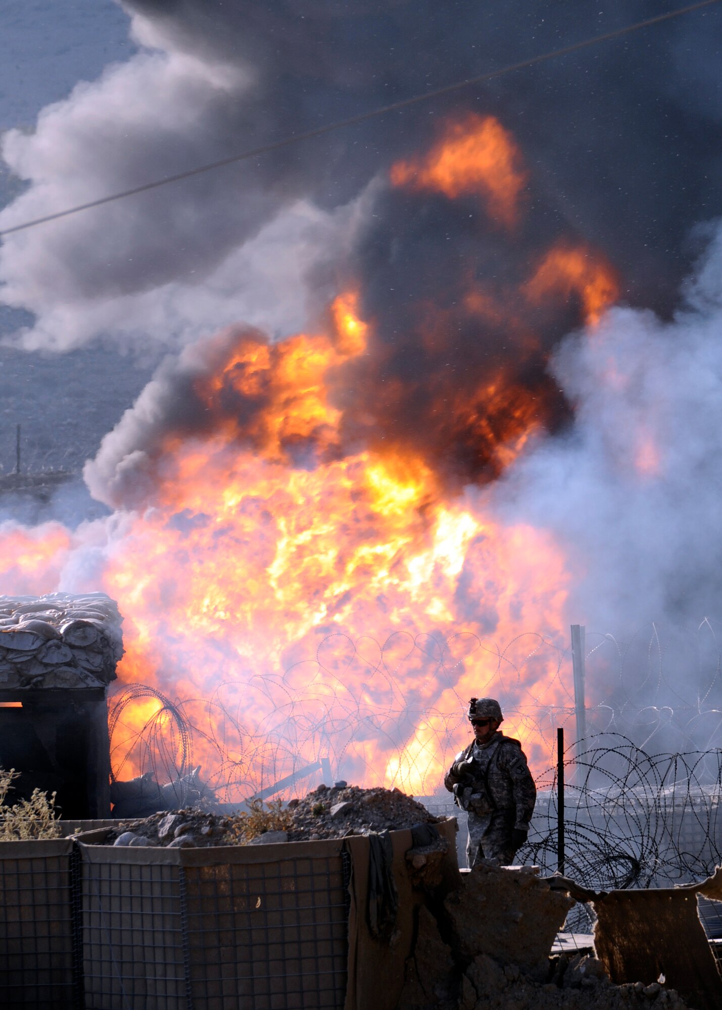 Provisional Construction Team combat photographer Senior Airman Chanise Epps put herself in the line of fire to capture photos of this attack on her forward operating base while deployed from the 548th ISR Group. Her photos helped FOB leadership assess the damage. (U.S. Air Force photo/Senior Airman Chanise Epps)