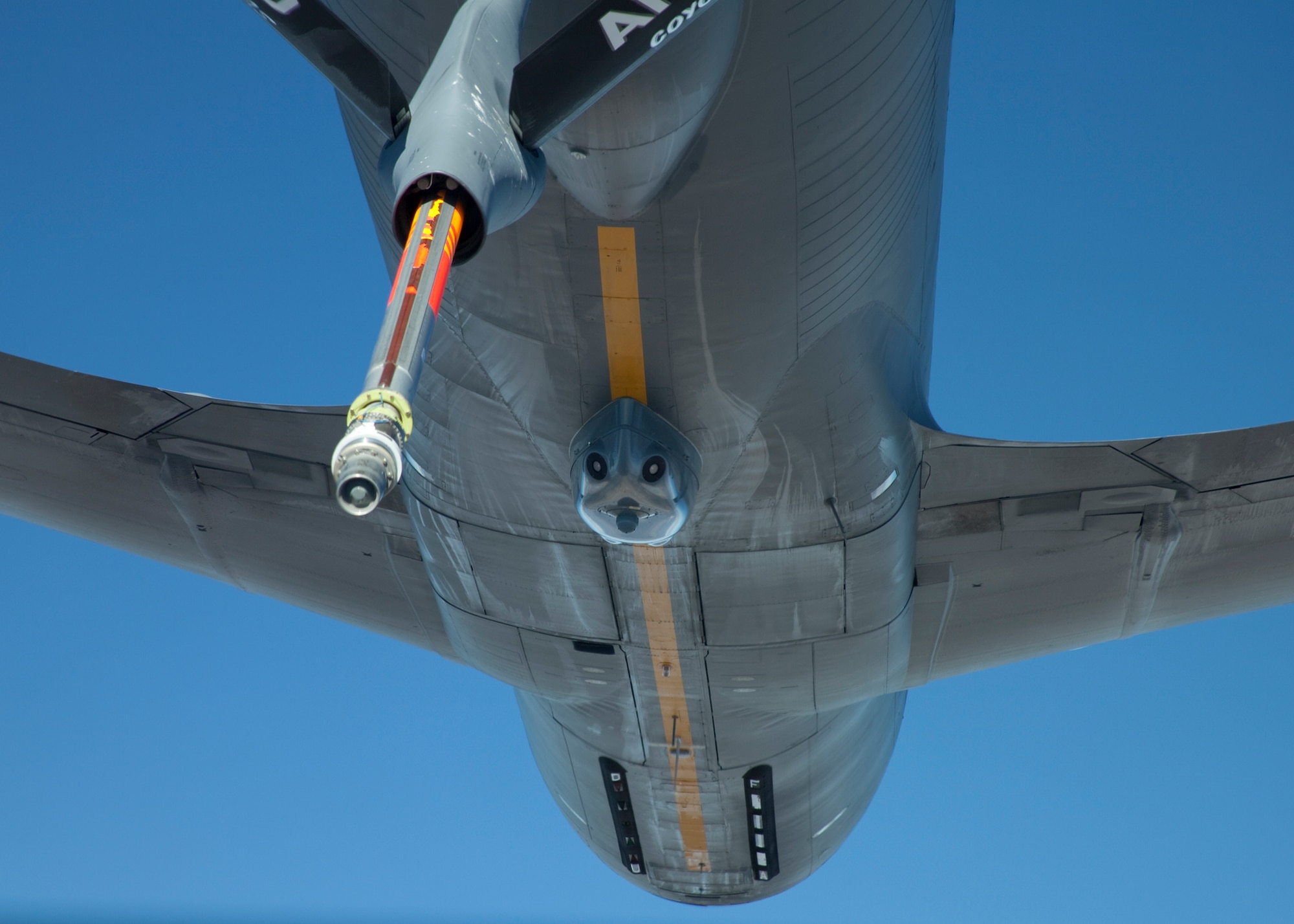 A Topeka, Kan. Air National Guard KC-135R equipped with a Large Aircraft Countermeasures System (center of the aircraft) performs an aerial refueling test as part of the handling qualities and aerial refueling tests performed on the tanker to ensure the LAIRCM pod doesn’t affect the flying and refueling capabilities of the KC-135. (Air Force photo by Chris Neill)