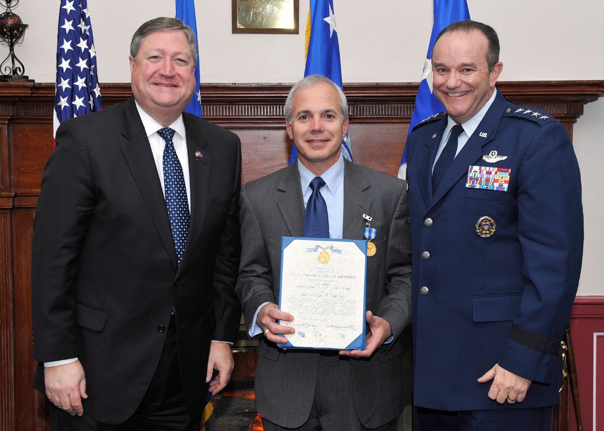 Michael Donley, Secretary of the Air Force, and Gen. Phillip Breedlove, Air Force Vice Chief of Staff, presented the Air Force Distinguished Public Service Award to Mr. George Condos during a dinner in honor of the Air Force Chief of Staff Civic Leaders Feb. 2, 2001, at Joint Base Anacostia-Bolling.  (U.S. Air Force photo/Michael J Pausic)  