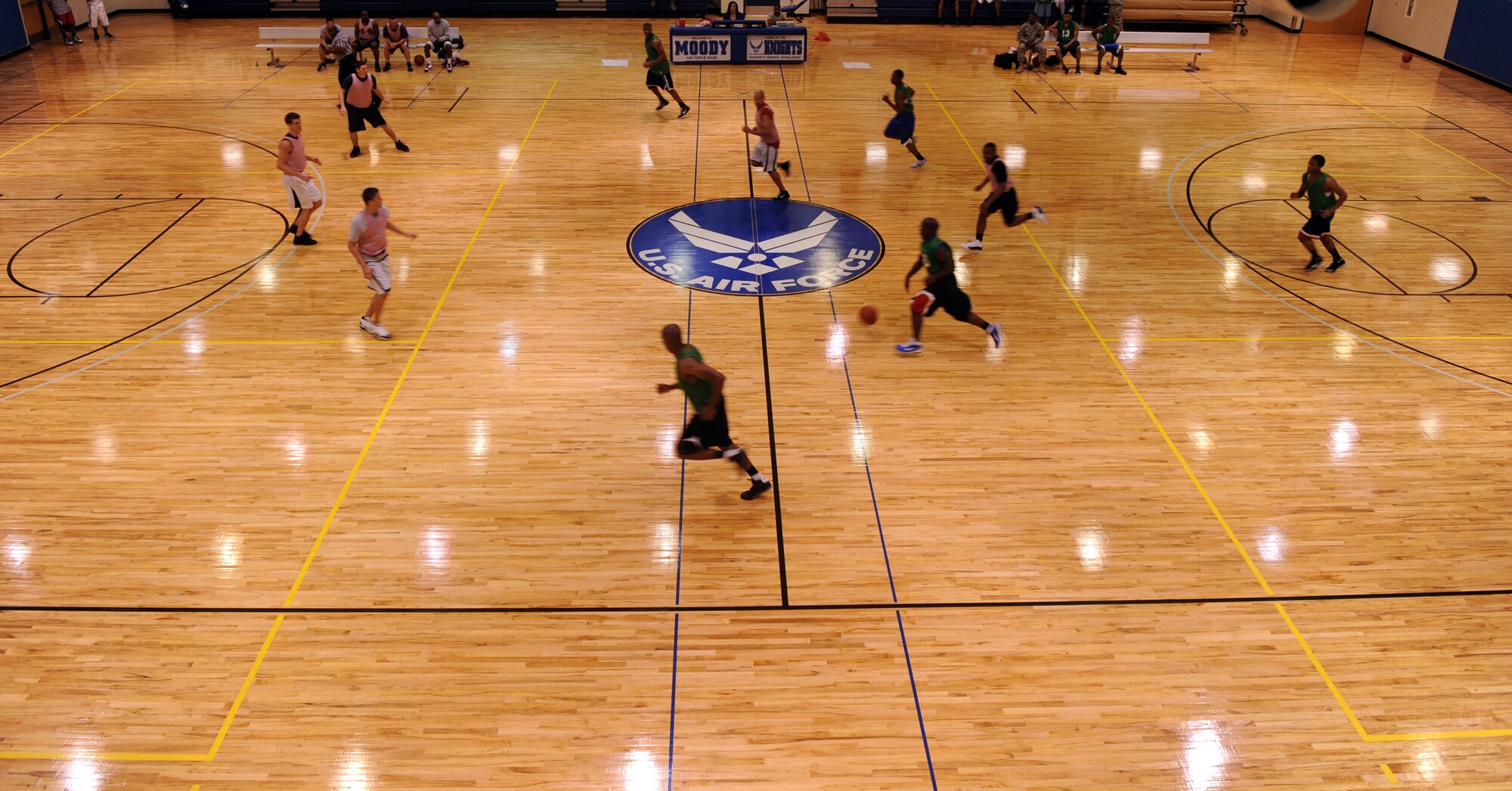 MOODY AIR FORCE BASE, Ga. -- A member of the 23rd Operations Support Squadron brings the ball up the court during an intramural basketball game against the 23rd Medical group Mar. 1. The 23rd MDG won the game by 15 points with a final score of 48-33. (U.S. Air Force photo/Airman 1st Class Douglas Ellis)(RELEASED)
