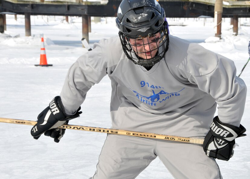 Members of the 914th Airlift Wing compete in the 2011 Labatt Blue Pond Hockey Tournament February 11, 2011 Buffalo, NY. Players compete in teams of four minus a goalie. (U.S. Air Force photo by Staff Sgt. Joseph McKee)