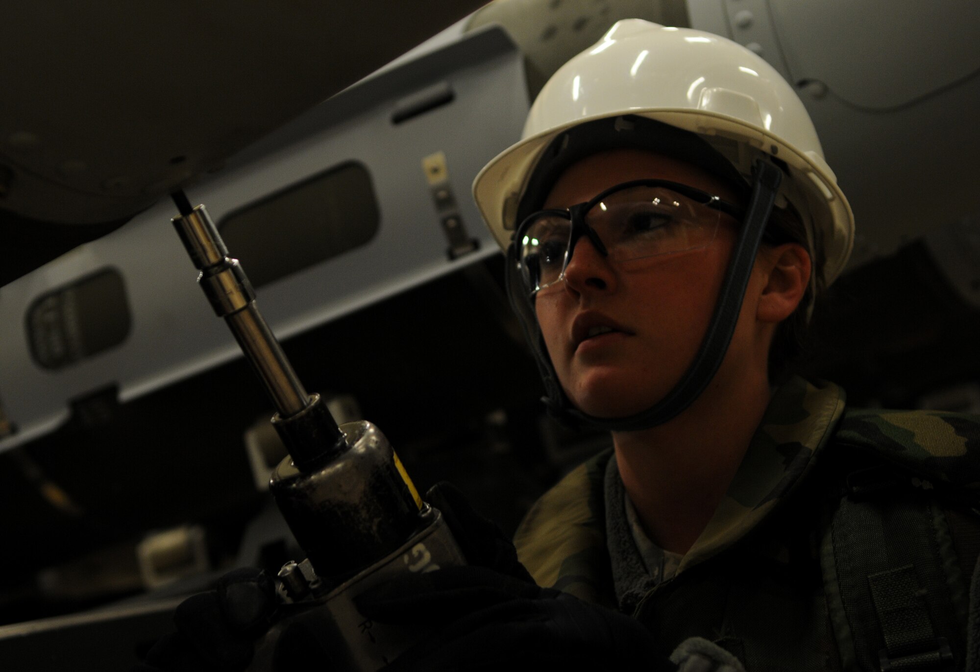 Senior Airman Sydney Keith, 18th Munitions Squadron munitions inspector, attaches the tail ends of Mark 83 bomb bodies during Beverly High 11-03, a local operational readiness exercise, on Kadena Air Base, Japan, March 3. During LOREs, Airmen are presented with training scenarios to test their abilities to operate in contingency environments. (U.S. Air Force photo/Airman 1st Class Jarvie Z. Wallace)