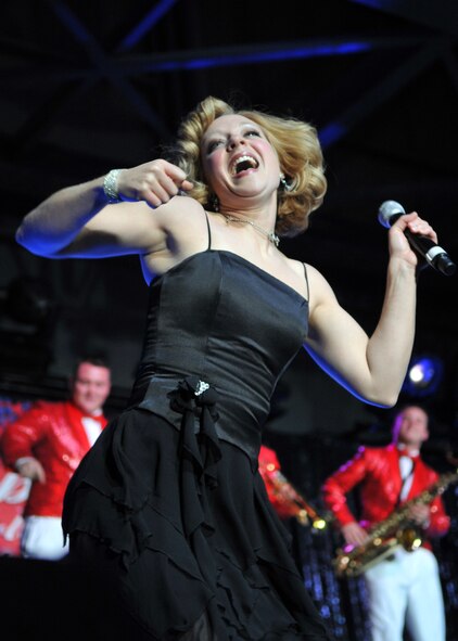 MINOT, N.D. – Tech. Sgt. Lesley Hunter, Tops in Blue vocalist, performs for the Minot community during a Tops in Blue performance at the State Fair Grounds here Feb. 23. Tops in Blue serves as an expeditionary entertainment unit to provide quality entertainment from within Air Force resources for the Air Force family and personnel. (U.S. Air Force photo/Airman 1st Class Jessica McConnell)