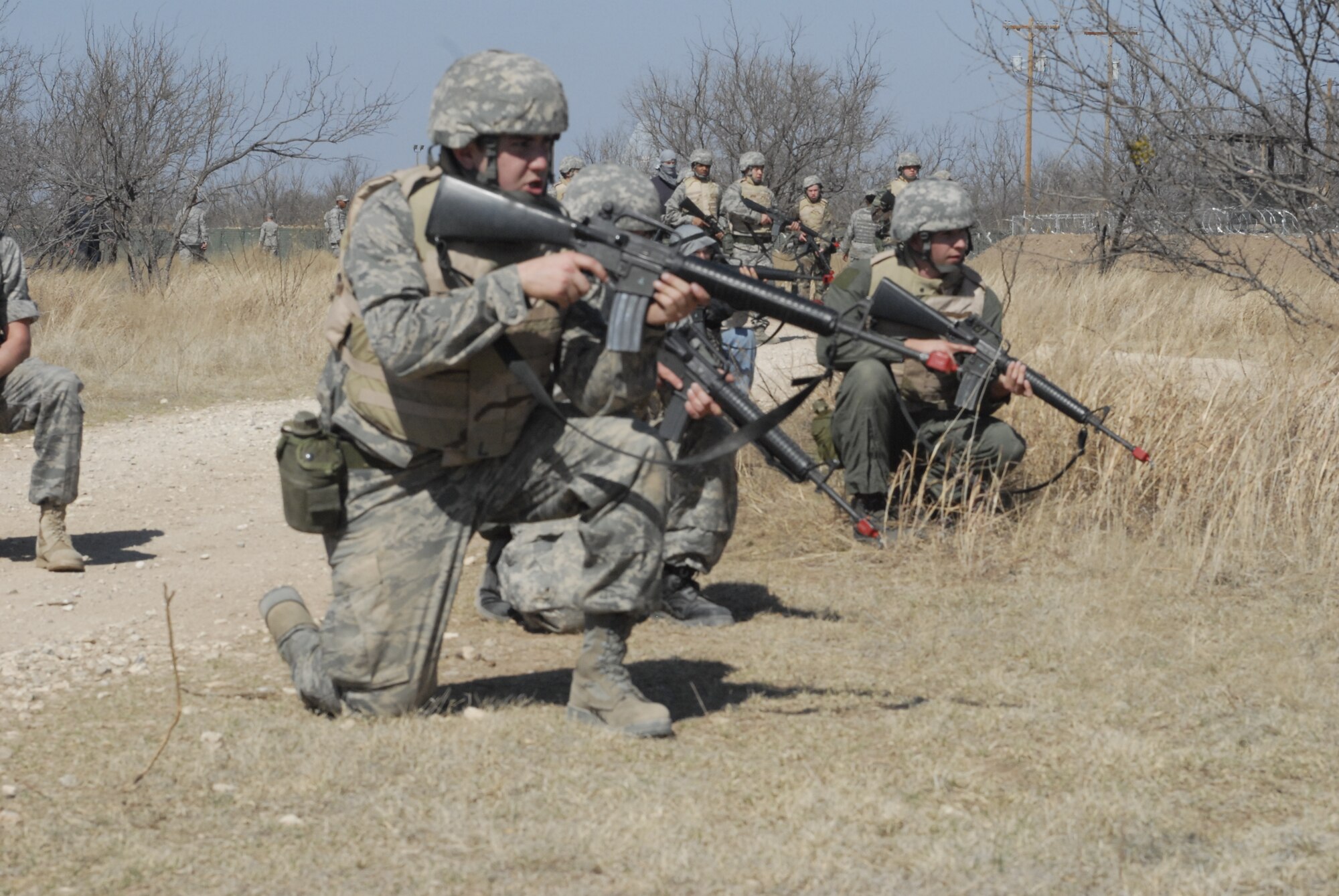 GOODFELLOW AIR FORCE BASE, Texas - Cadets from the Air Force Reserve Officer Training Corps, Angelo State University, react after spotting a suspicious person during their training  Feb. 26 at the Forward Operating Base Camp Sentinel. This was part of a two day training session designed to teach them what military life entails. (U.S. Air Force photo/Senior Airman Anne Gathua