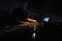 MINOT, N.D. – Airman 1st Class William Anger, Tops in Blue audio engineer, manages the sound during a Tops in Blue performance at the State Fair Grounds here Feb. 23. Tops in Blue serves as an expeditionary entertainment unit to provide quality entertainment from within Air Force resources for the Air Force family and personnel. (U.S. Air Force photo/Staff Sgt. Keith Ballard)