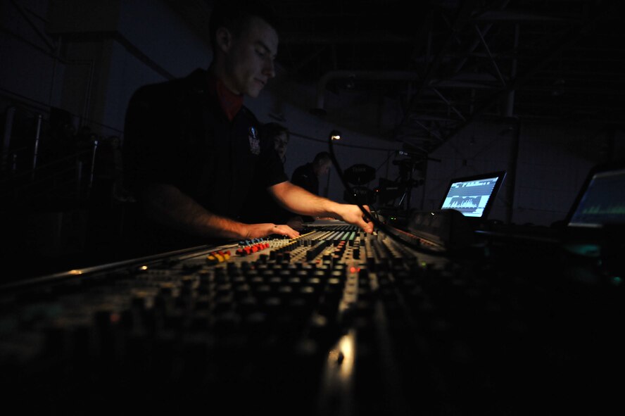 MINOT, N.D. – Airman 1st Class William Anger, Tops in Blue audio engineer, manages the sound during a Tops in Blue performance at the State Fair Grounds here Feb. 23. Tops in Blue serves as an expeditionary entertainment unit to provide quality entertainment from within Air Force resources for the Air Force family and personnel. (U.S. Air Force photo/Staff Sgt. Keith Ballard)