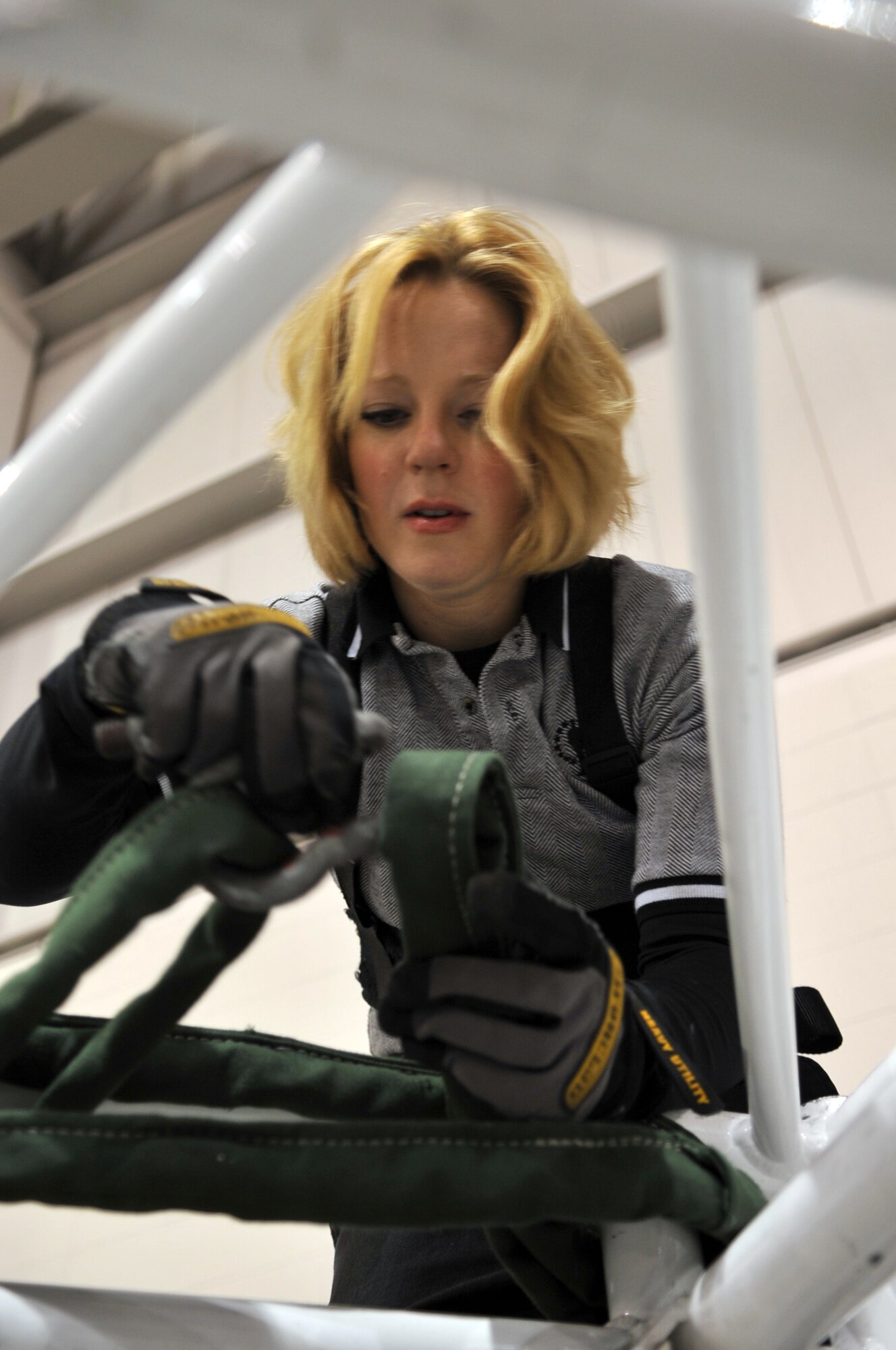MINOT, N.D. – Tech. Sgt. Lesley Hunter, Tops in Blue vocalist, sets up for the Tops in Blue performance at the State Fair Grounds here Feb. 23.  Tops in Blue serves as an expeditionary entertainment unit to provide quality entertainment from within Air Force resources for the Air Force family and personnel. (U.S. Air Force photo/Airman 1st Class Jessica McConnell)