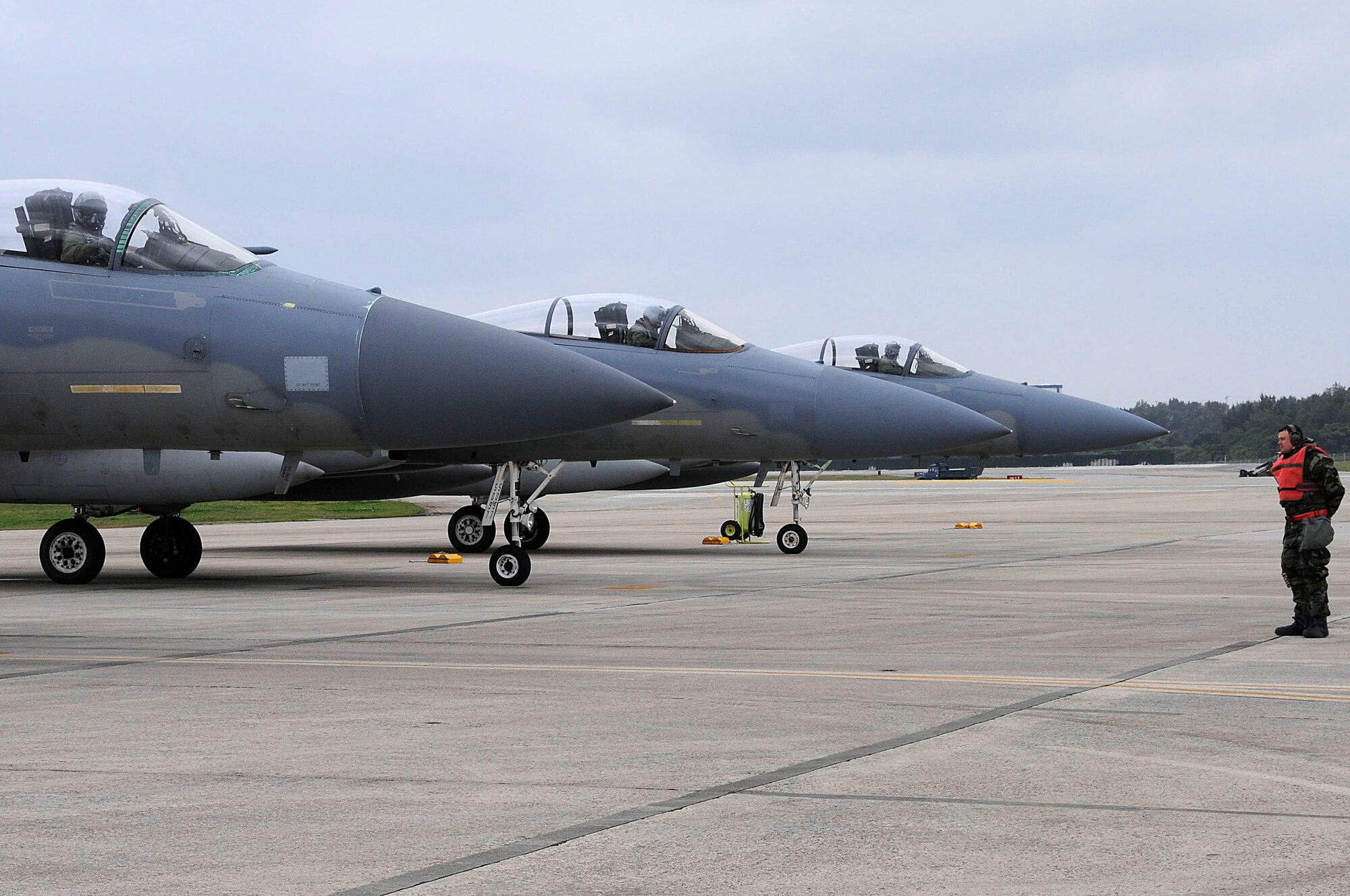Staff Sgt. David Graffius, 18th Aircraft Maintenance Squadron crew chief, marshals an F-15 Eagles during the local operational readiness exercise here at Kadena Air Base, Japan March 2. The exercise tested Team Kadena's ability to operate and complete the mission during various contingency scenarios. (U.S. Air Force photo/ Staff Sgt. Darnell T. Cannady)