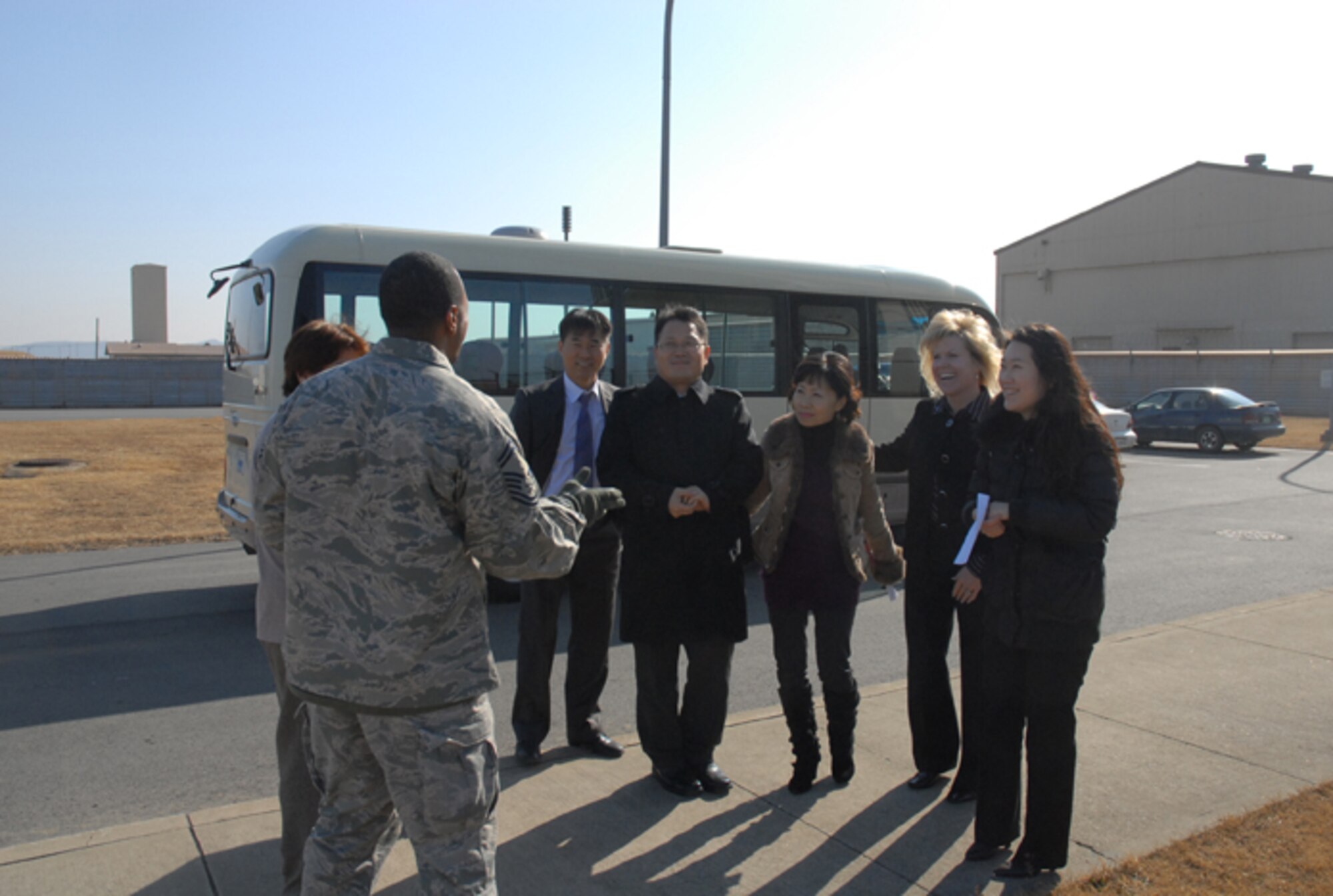 KUNSAN AIR BASE, Republic of Korea -- Senior Master Sgt. Michael Murdock, 8th Operations Support Squadron control tower chief controller, greets participants of a Kunsan AB tour recently provided to Gunsan City Good Neighbor Orientation Tour guides and Peggy Baker, wife of Chief Master Sgt. Tom Baker, 7th Air Force command chief. The 8th Fighter Wing’s Airman and Family Readiness Center provided the tour in appreciation to the Gunsan City officials who guide the center’s monthly tour of Gunsan. (Courtesy photo/Yi Song-Chin)