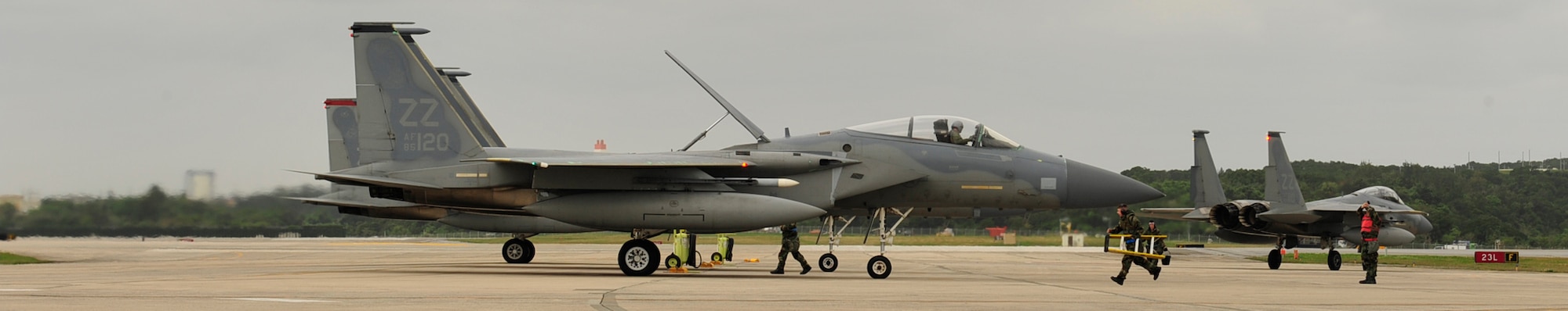 18th Aircraft Maintenance Squadron members de-arm F-15 Eagles from the 67th and 44th Fighter Squadrons during the local operational readiness exercise here at Kadena Air Base, Mar. 2. The LORE allows base personnel to practice operations in different exercise scenarios and prepare for real world contingencies. (U.S. Air Force photo/Staff Sgt. Lakisha A. Croley)