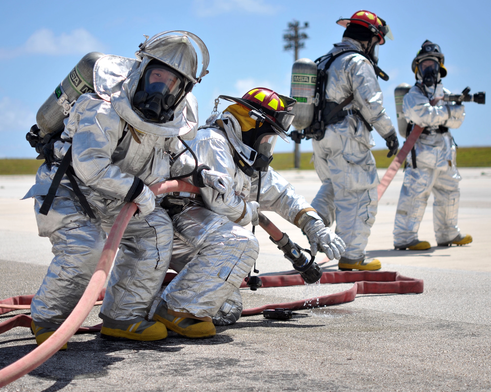 ANDERSEN AIR FORCE BASE, Guam - Members of the Andersen Fire Department participate in Operational Readiness Exercise here Mar. 2. The fire department practiced egress skills that are needed in the event of a fire onboard an aircraft. (U.S Air Force photo/Airman Julian North)