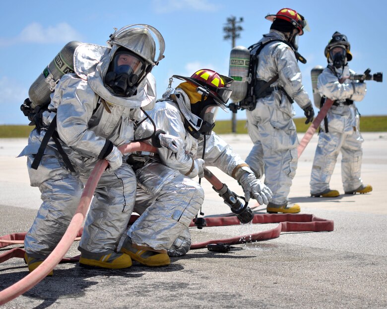 ANDERSEN AIR FORCE BASE, Guam - Members of the Andersen Fire Department participate in Operational Readiness Exercise here Mar. 2. The fire department practiced egress skills that are needed in the event of a fire onboard an aircraft. (U.S Air Force photo/Airman Julian North)