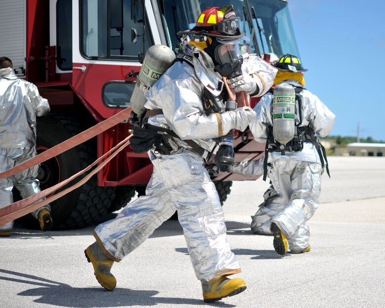 ANDERSEN AIR FORCE BASE, Guam - Members of the Andersen Fire Department participate in Operational Readiness Exercise here Mar. 2. The fire department practiced egress skills that are needed in the event of a fire onboard an aircraft. (U.S Air Force photo/Airman Julian North)