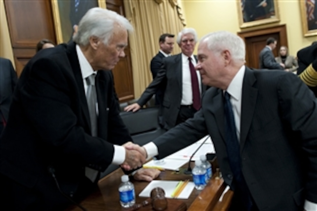 Defense Secretary Robert M. Gates, right, thanks Congressman C.W. Bill Young after testifying  at a hearing of the House Appropriations Committee's defense subcommittee on the fiscal 2012 budget in Washington, D.C., March 3, 2011. Young chairs the subcommittee.  