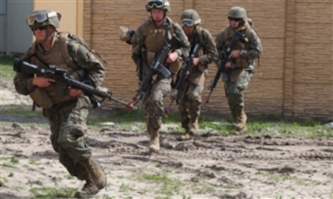 U.S. Marines with the 1st Tank Battalion quick reaction force move toward a rally point at Camp Pendleton, Calif., during a reaction force raid training exercise on Feb. 28, 2011.  The training was part of Exercise Iron Fist, a three-week bilateral training event between the Marine Corps and Japan Ground Self-Defense Force designed to increase interoperability between the two services while aiding the Japanese in their continued development of amphibious capabilities.  