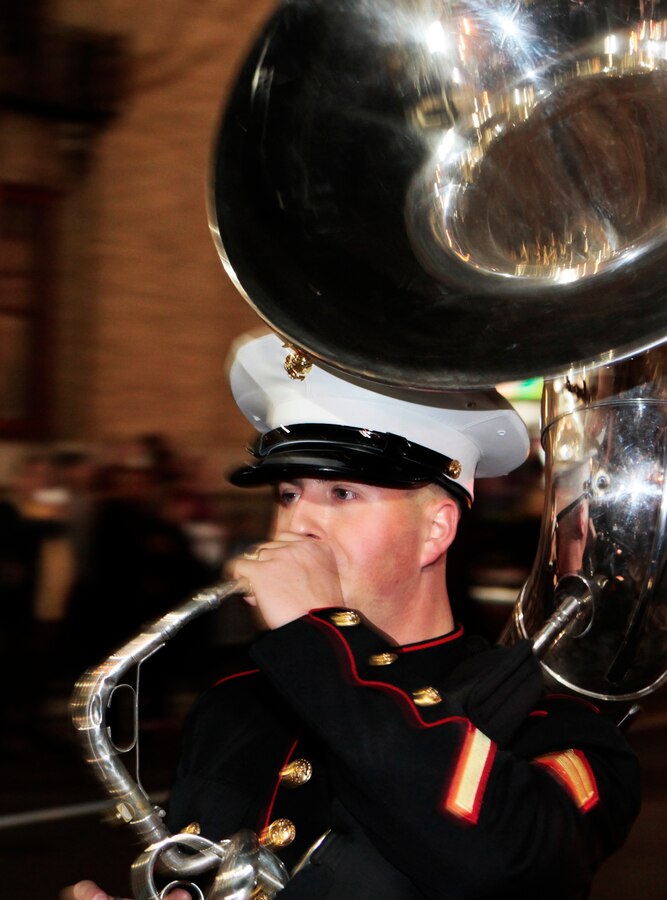 A Marine Corps Band New Orleans sousaphone player makes his way down St. Charles during a March 2 parade. His instrument weighs about 35 pounds. The band covers an average of 12 parades every Mardi Gras season, many stretching up to 6.5 miles long. (Official Marine Corps photo by Cpl. Jad Sleiman)