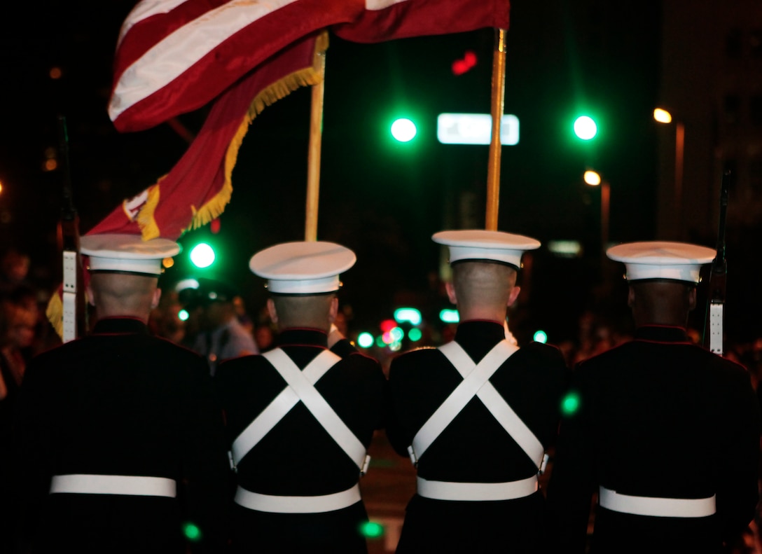A Marine color guard makes its way down Poydras in the Central Business District during a March 2 parade. The Marine Corps Band New Orleans covers an average of 12 parades every Mardi Gras season, many stretching up to 6.5 miles long. (Official Marine Corps photo by Cpl. Jad Sleiman)