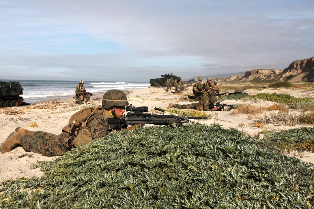 Marines with Kilo Company, 3rd Battalion, 7th Marines set up security ashore at Camp Pendleton's Red Beach, March 3. Kilo Company is participating in Pacific Horizon 11, a maritime prepositioning force exercise to prepare Marines and sailors for crisis response. (U.S. Marine Corps Photo by Sgt. Marcy Sanchez)