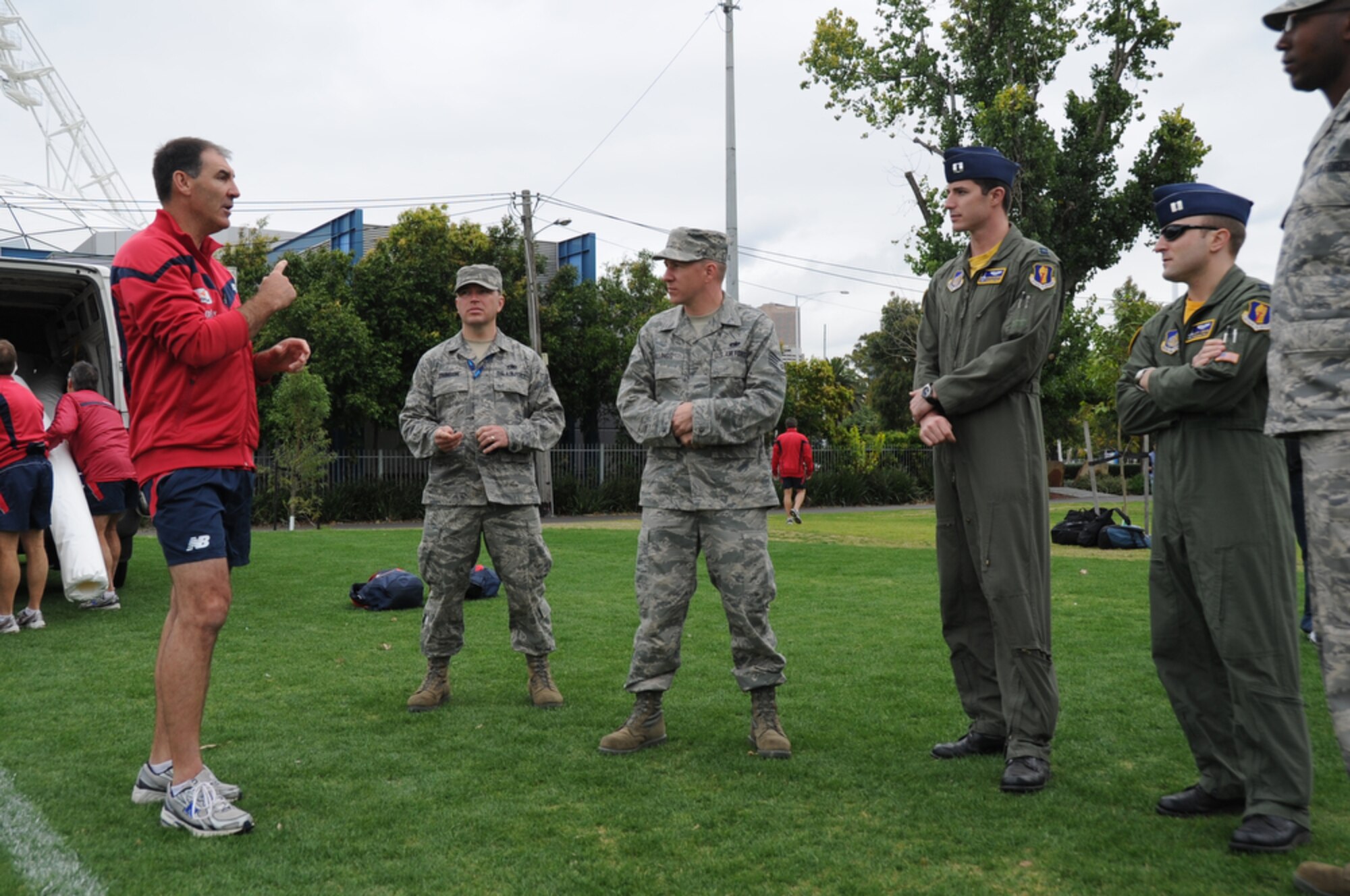 Airmen joined Sailors in gaining some knowledge about Australian Rules Football from players representing the Melboune Demons Football Club at Gosch’s Paddock in Melbourne, Australia, March 4, 2011. The Airmen are from Kadena Air Base, Japan, and Dyess Air Force Base, Texas, while the Sailors are from the  San Diego-based USS Shoup. The two groups took time out from attending the Avalon 2011 Australian International Airshow and Aerospace and Defence Exposition in Geelong, Australia. The event is one of the largest airshows in the world. The U.S. and Australian alliance spans more than 60 years and provides an opportunity for U.S and senior military officials to engage with their Australian counterparts, and ultimately contribute toward interoperability between the forces. (U.S.  Air Force photo/Master Sgt. Cohen A. Young)