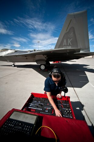 NELLIS AIR FORCE BASE, Nev. --  Senior Airman Samantha Whisman, 90th Aircraft Maintenance Squadron, crew chief, from Elmendorf Air Force Base, Alaska, looks over her tools for accountability before launching an F-22 Raptor for a training mission during Red Flag 11-3, March 2. Red Flag is a realistic combat training exercise involving the air forces of the United States and its allies. The exercise takes place north of Las Vegas on the Nevada Test and Training Range--the U.S. Air Force's premier military training area with more than 12,000 square miles of airspace and 2.9 million acres of land. (U.S. Air Force photo by Tech Sgt. Michael R. Holzworth)
