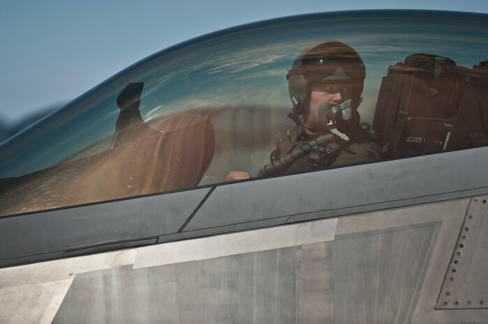 NELLIS AIR FORCE BASE, Nev. --  Capt. Drew Maulsby, 90th Fighter Squadron pilot, from Elmendorf Air Force Base, Alaska, goes over pre-flight check in a F-22 Raptor during Red Flag 11-3, March 2. Red Flag is a realistic combat training exercise involving the air forces of the United States and its allies. The exercise takes place north of Las Vegas on the Nevada Test and Training Range--the U.S. Air Force's premier military training area with more than 12,000 square miles of airspace and 2.9 million acres of land. (U.S. Air Force photo by Tech Sgt. Michael R. Holzworth)