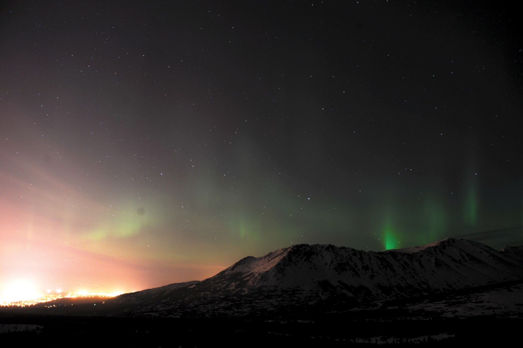 A solar wind stream hit Earth's magnetic field on March 1st, sparking a day-long geomagnetic storm and bright auroras around the Arctic Circle, according to www.spaceweather.com (U.S. Air Force photo/Staff Sgt. Joshua Garcia)