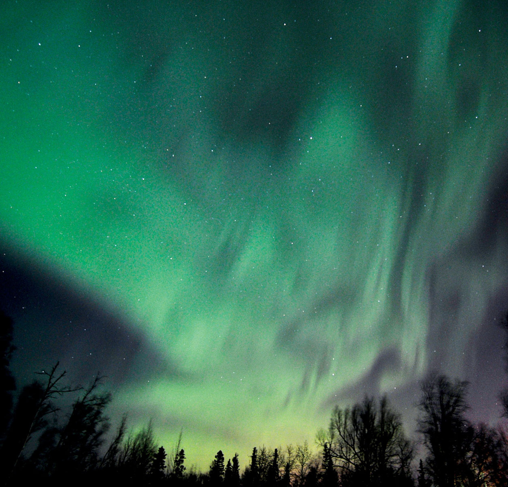 A solar wind stream hit Earth's magnetic field on March 1st, sparking a day-long geomagnetic storm and bright auroras around the Arctic Circle, according to www.spaceweather.com (U.S. Air Force photo/John Pennell)