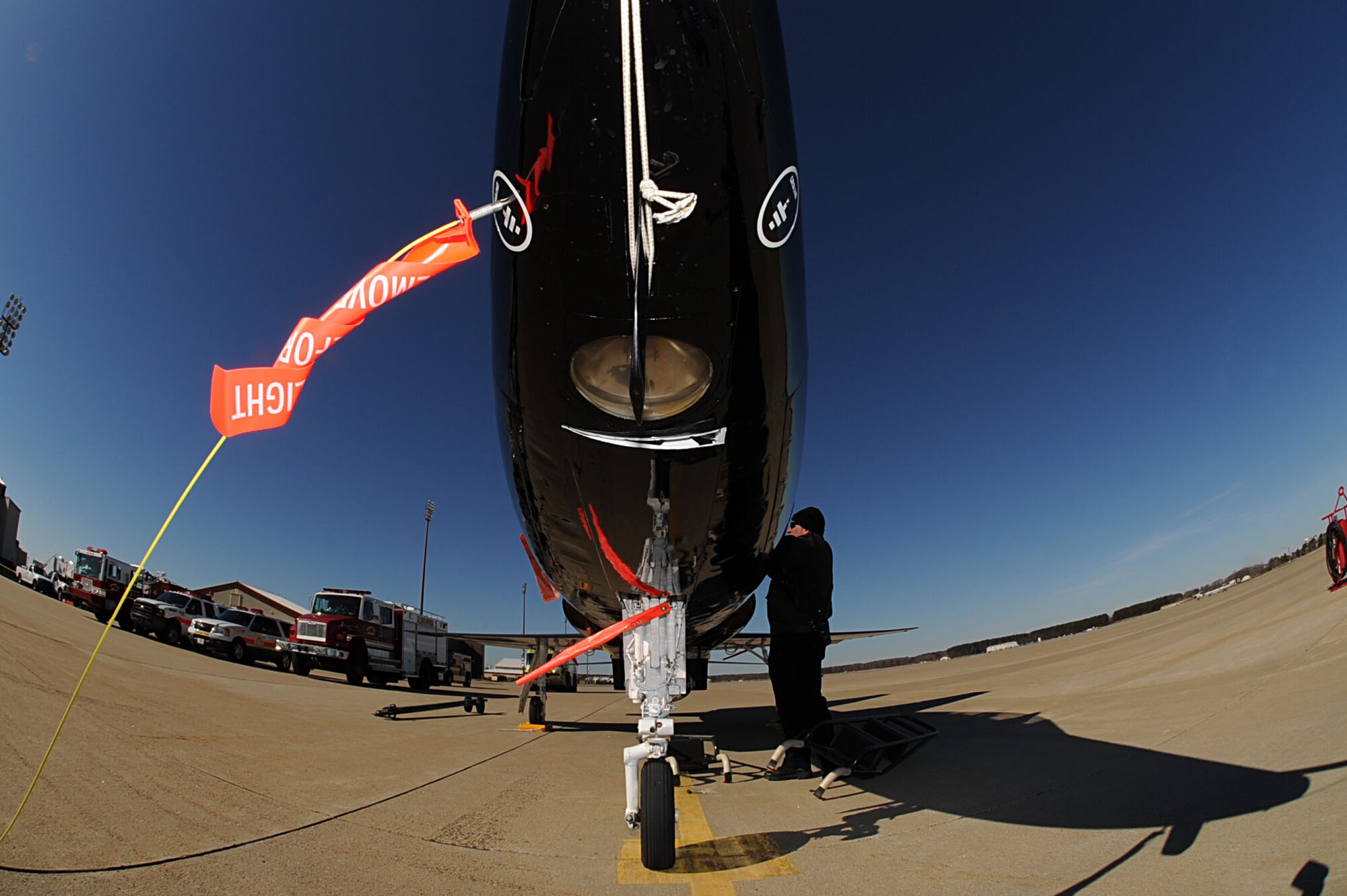 Douglas Faber, 633rd Civil Engineer Squadron Fire Department assistant chief trainer, prepares a T-38 Talon for extraction training at Langley Air Force Base, Va., March 3, 2011. The Langley Fire Department conducts extraction training to ensure firefighters can adequately remove a pilot during an emergency. (U.S. Air Force photo by Senior Airman Brian Ybarbo/Released)
