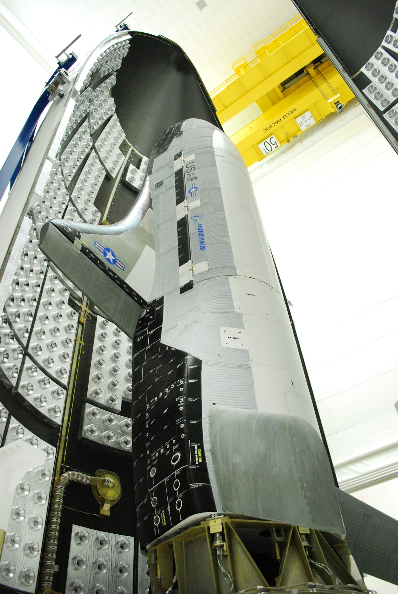 The US Air Force X-37B Orbital Test Vehicle during encapsulation within the
United Launch Alliance Atlas V 5-meter fairing  Feb. 8, 2011, at Astrotech in Titusville, Fla. The fairing protects and carries the OTV into space. (Courtesy photo)