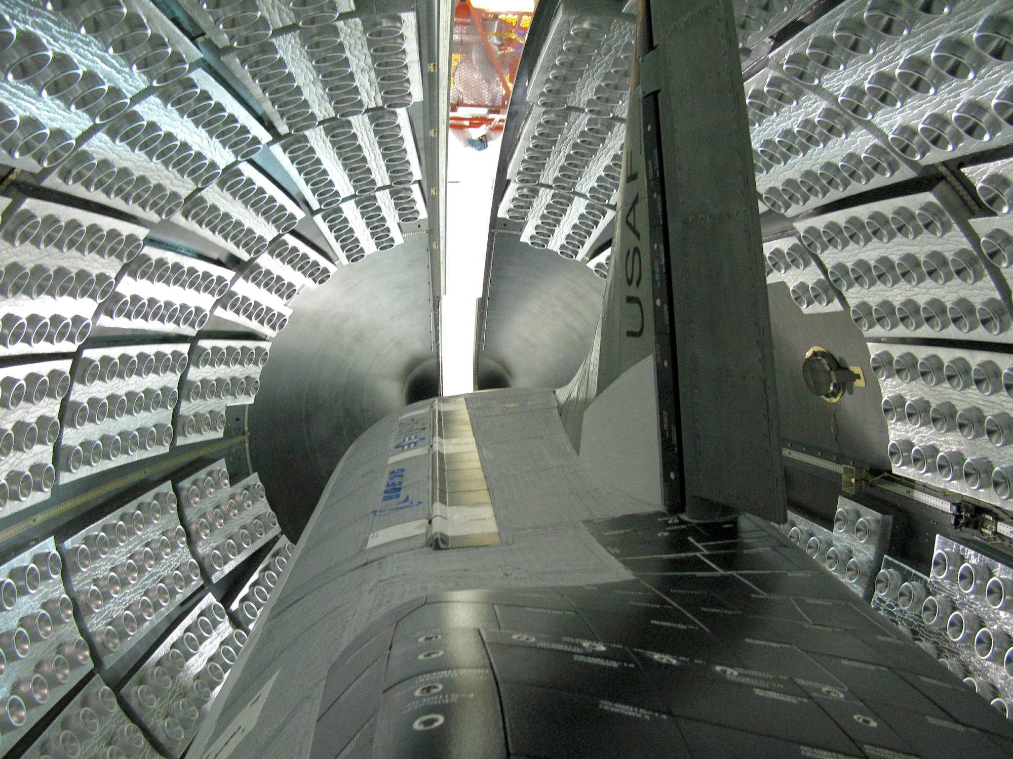 The US Air Force X-37B Orbital Test Vehicle during encapsulation within the United Launch Alliance Atlas V 5-meter fairing  Feb. 8, 2011, at Astrotech in Titusville,
Fla. The fairing protects and carries the OTV into space. (Courtesy photo)