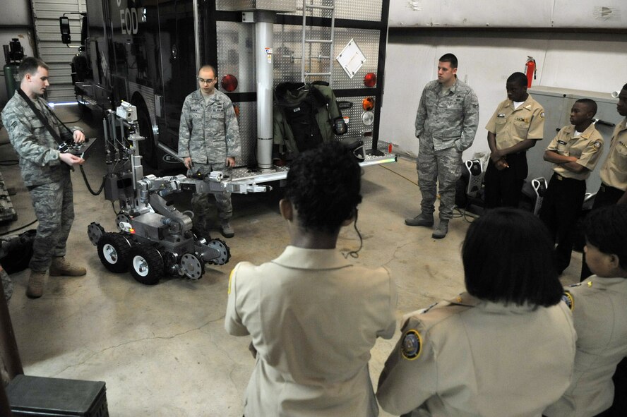 Members from the 2nd Civil Engineer Squadron Explosive Ordnance Disposal Flight demonstrate how to operate an Andros F6A EOD robot for Navy Junior Reserve Officer Training Corps cadets from Neville High School in the EOD garage on Barksdale Air Force Base, La., March 2. The cadets were given an opportunity to pilot the EOD robot and wear  explosive ordnance disposal suits. Neville High School is located in Monroe, La. (U.S. Air Force photo/Airman 1st Class Micaiah Anthony)(RELEASED)