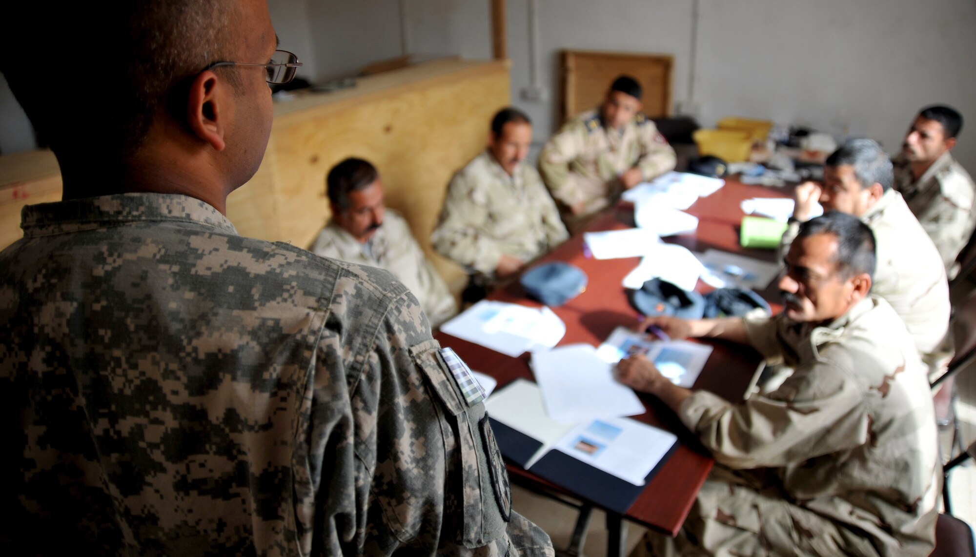 Army 1st Lt. Vijaj Soprey, 224th Sustainment Brigade physician assistant, gives a medical training course to Iraqi airmen Feb. 23, 2011, at the medical clinic on Ali Air Base, Iraq. Airmen assigned to the base transition team here have helped improve the clinic’s ability to meet the needs of the Iraqi Air Force by providing $200,000 in essential medical equipment, increasing storage capacity and coordinating monthly self-aid buddy care training. (U.S. Air Force photo by Senior Airman Andrew Lee/Released)