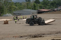 Reservists with the 567th RED HORSE Squadron prepare a site in Panama for a floor laydown. Airmen deployed in 2010 as part of New Horizons to support base build-up and tear down in the area. (USAF photo courtesy of 567RHS)