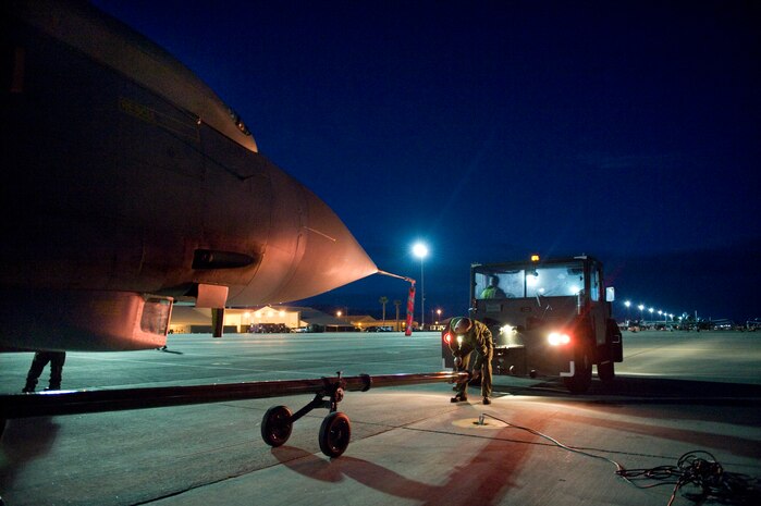 NELLIS AIR FORCE BASE, Nev. -- Royal Air Force maintainers from the No. 9 Squadron tow a Tornado GR4 back to the hanger during Red Flag, March 1.  Red Flag is a realistic combat training exercise involving the air forces of the United States and its allies.  The exercise is hosted north of Las Vegas on the Nevada Test and Training Range.   (U.S. Air Force Photo by Staff Sgt. William P. Coleman)