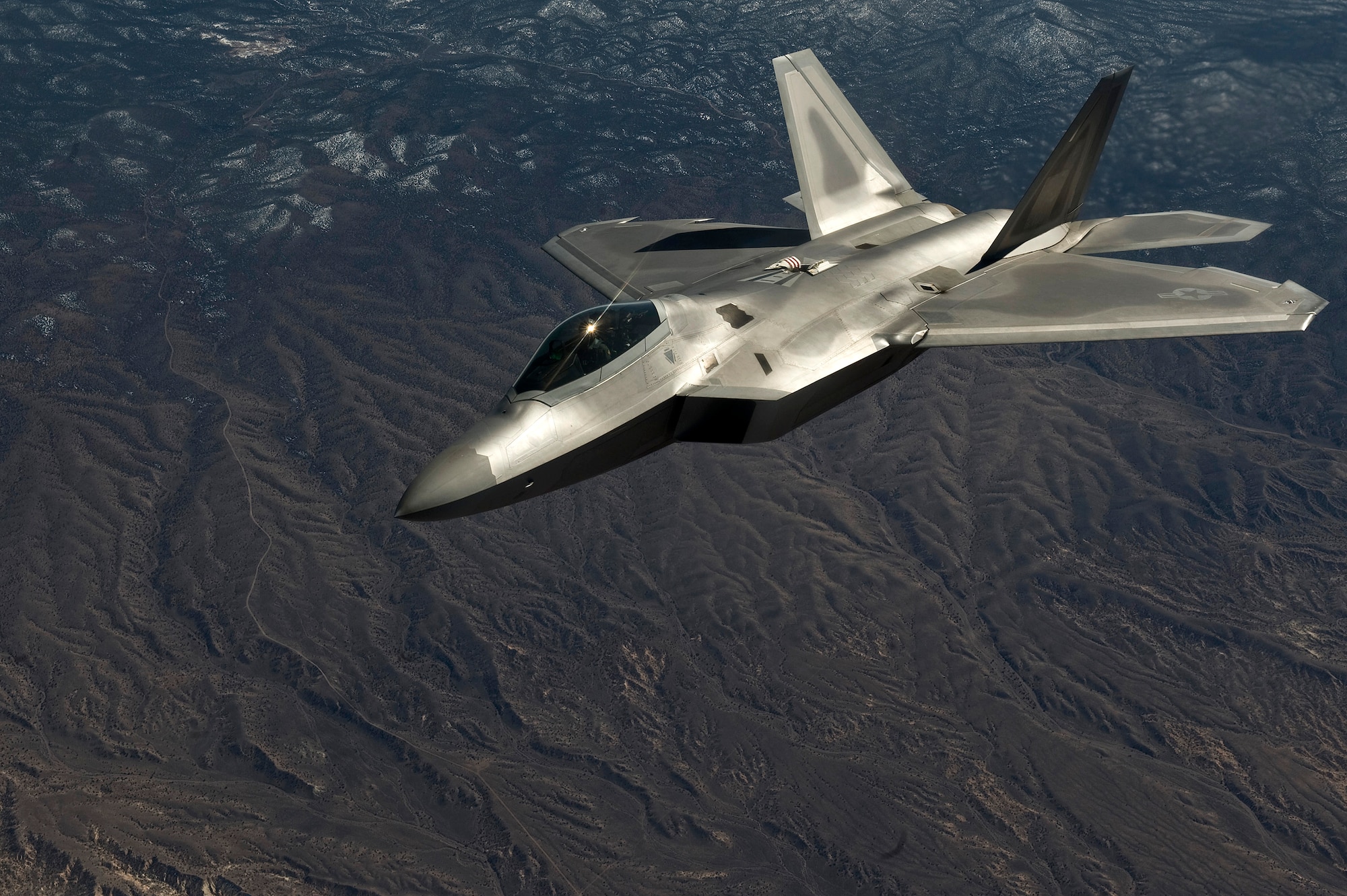 NEVADA TEST AND TRAINING RANGE -- A U.S. Air Force F-22 Raptor, 49th Fighter Wing, Holloman Air Force Base, N.M., flies a training mission during Red Flag 11-3, March 2. Red Flag is a realistic combat training exercise involving the air forces of the United States and its allies. The exercise is hosted north of Las Vegas on the Nevada Test and Training Range.(U.S. Air Force photo by Senior Airman Brett Clashman)

