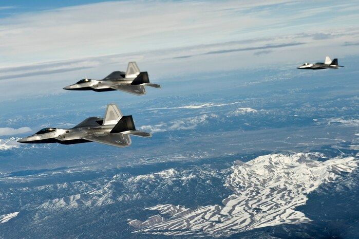 NEVADA TEST AND TRAINING RANGE -- A 3- ship of U.S. Air Force F-22 Raptors, 3rd Fighter Wing, Elmendorf Air Force Base, Alaska, fly for a training mission during Red Flag 11-3, March 2. Red Flag is a realistic combat training exercise involving the air forces of the United States and its allies. The exercise is hosted north of Las Vegas on the Nevada Test and Training Range.(U.S. Air Force photo by Senior Airman Brett Clashman)
