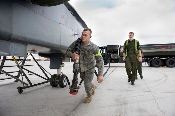 NELLIS AIR FORCE BASE, Nev. --  Senior Airman Nick Kester, 23rd Logistics Readiness Squadron, Moody Air Force Base, Ga. and Royal Air Force Senior Aircraftsman Christopher Harris, No. 9 Squadron, refuel a Tornado GR4  during Red Flag 11-3, March 1. Red Flag is a realistic combat training exercise involving the air forces of the United States and its allies.  The exercise is hosted north of Las Vegas on the Nevada Test and Training Range.   (U.S. Air Force Photo by Staff Sgt. William P. Coleman)