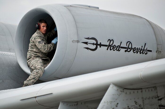NELLIS AIR FORCE, Nev. --  Staff Sgt. Aaron Casteel, 127th Aircraft Maintenance Squadron crew chief, from Selfridge Air National Guard Base Mich.,  performs a post flight check on an A-10 Thunderbolt II engine during Red Flag 11-3, March 1.  Red Flag is a realistic combat training exercise involving the air forces of the United States and its allies. The exercise takes place north of Las Vegas on the Nevada Test and Training Range--the U.S. Air Force's premier military training area with more than 12,000 square miles of airspace and 2.9 million acres of land. (U.S. Air Force photo by Tech Sgt. Michael R. Holzworth)