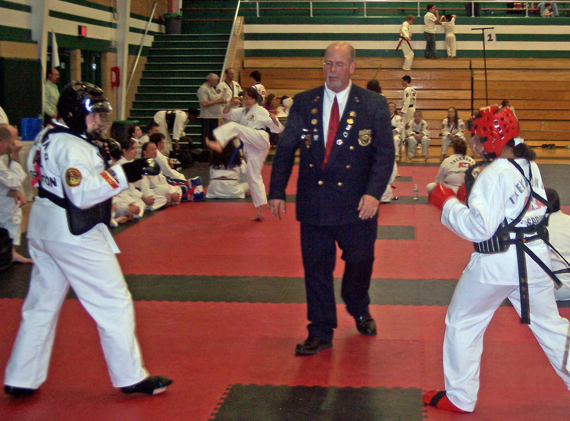 Peterson Taekwondo Club member Jenna Cabell, right, spars with a competitor Feb. 19 at the American Taekwondo Association Winter Regional Tournament in Aurora, Colo. It was Miss Cabell’s first time competing in a tournament and she entered the women 17-30 year olds, 1-3 degree black belt category.  (Photo courtesy of the Peterson Taekwondo Club)