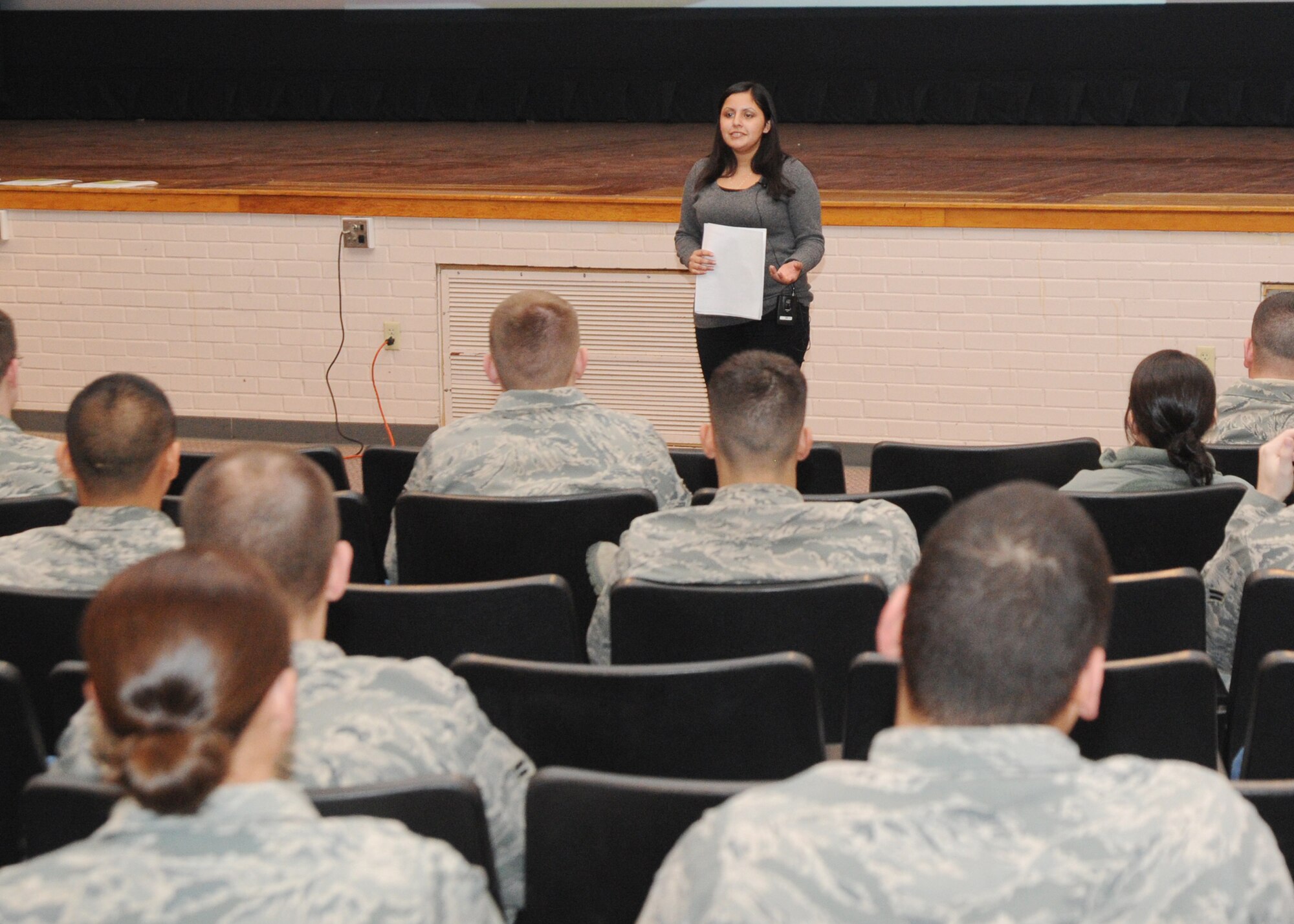 Jasmine Ceja, Break the Cycle youth programs coordinator, speaks to Team McConnell members during a dating violence seminar Feb. 25, 2011, McConnell Air Force Base, Kan. Break the Cycle is a nonprofit organization empowering youth to end domestic violence. Ms. Ceja explains warning signs of dating abuse and ways a victim can end an abusive relationship. (U.S. Air Force photo/Airman 1st Class Katrina M. Brisbin)