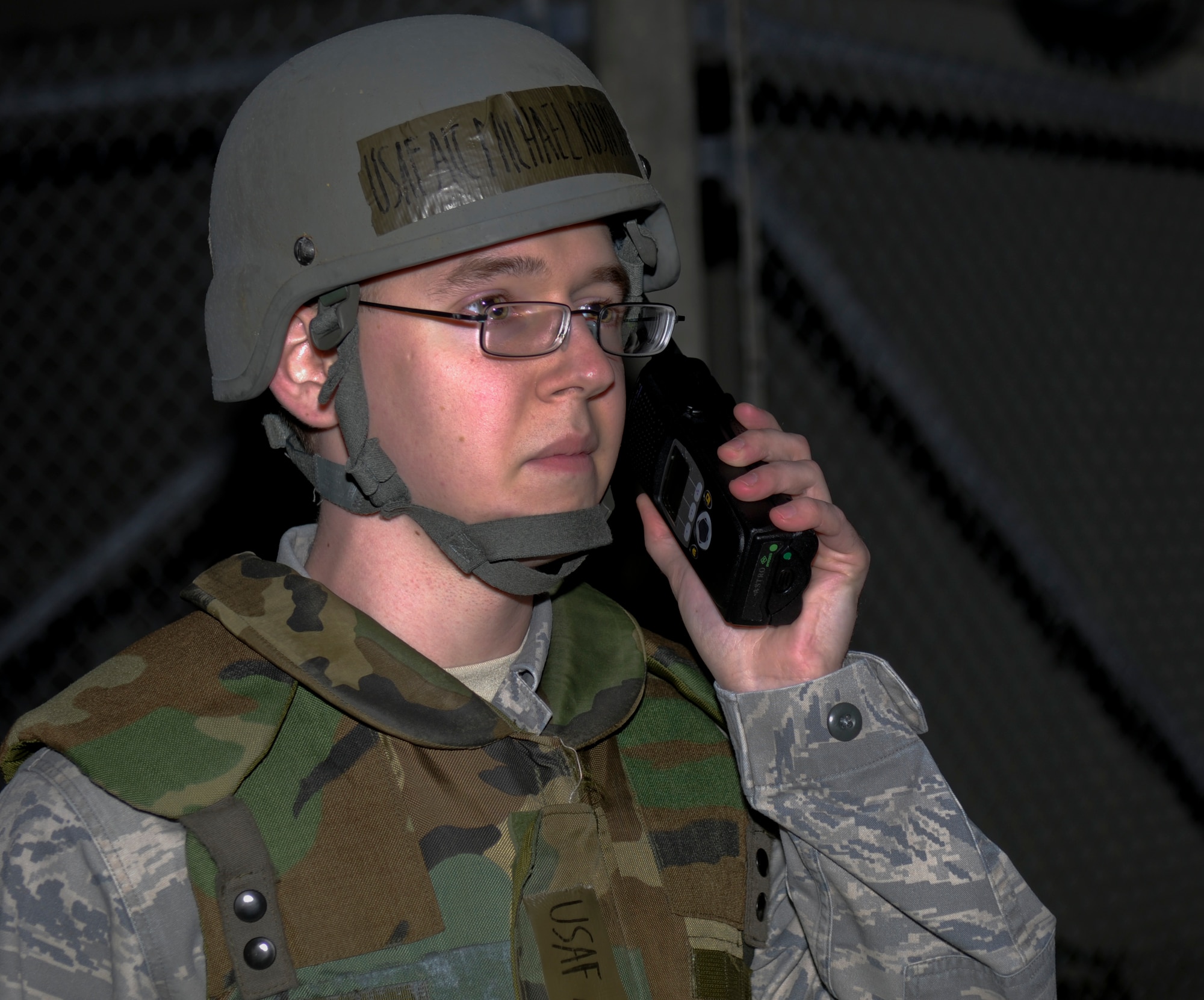 Airman 1st Class Michael Rosinski, a member of the 18th Communication Squadron, calls in unexploded ordnance during a scenario for the local operational readiness exercise Beverly High 11-03, on Kadena Air Base, March 3. The LORE used various training scenarios to train Airmen and prepare them to respond to real-world emergency situations. (U.S. Air Force photo/Airman 1st Class Brooke P. Beers)