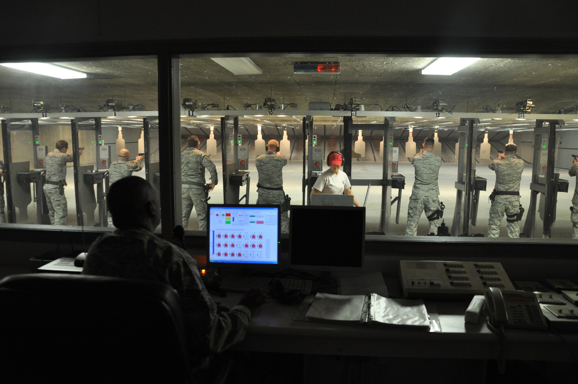 WRIGHT-PATTERSON AIR FORCE BASE, Ohio – Tech. Sgt. Andre Sims, 445th Security Forces Squadron, gives instructions to Airmen from his unit for 9 mm pistol qualification during the Feb. 6 unit training assembly.  This training is an annual requirement for security forces. (U.S. Air Force photo/Tech. Sgt. Jeremy Caskey)