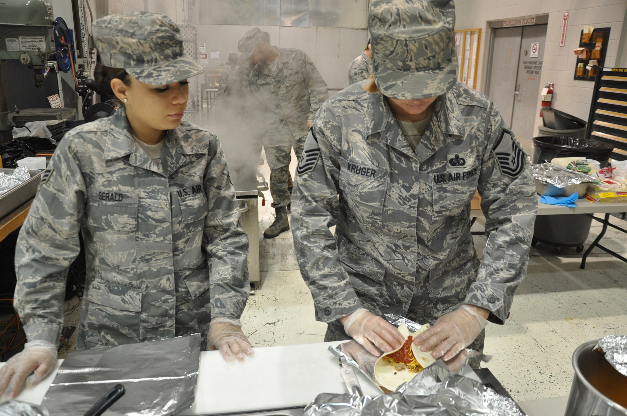 WRIGHT-PATTERSON AIR FORCE BASE, Ohio - Master Sgt. Kelly Kruger and Senior Airman Nastasskia Gerald, 445th Services Squadron, prepare breakfast burritos during the Feb. 6 unit training assembly. (U.S. Air Force photo/Tech. Sgt. Jeremy Caskey)