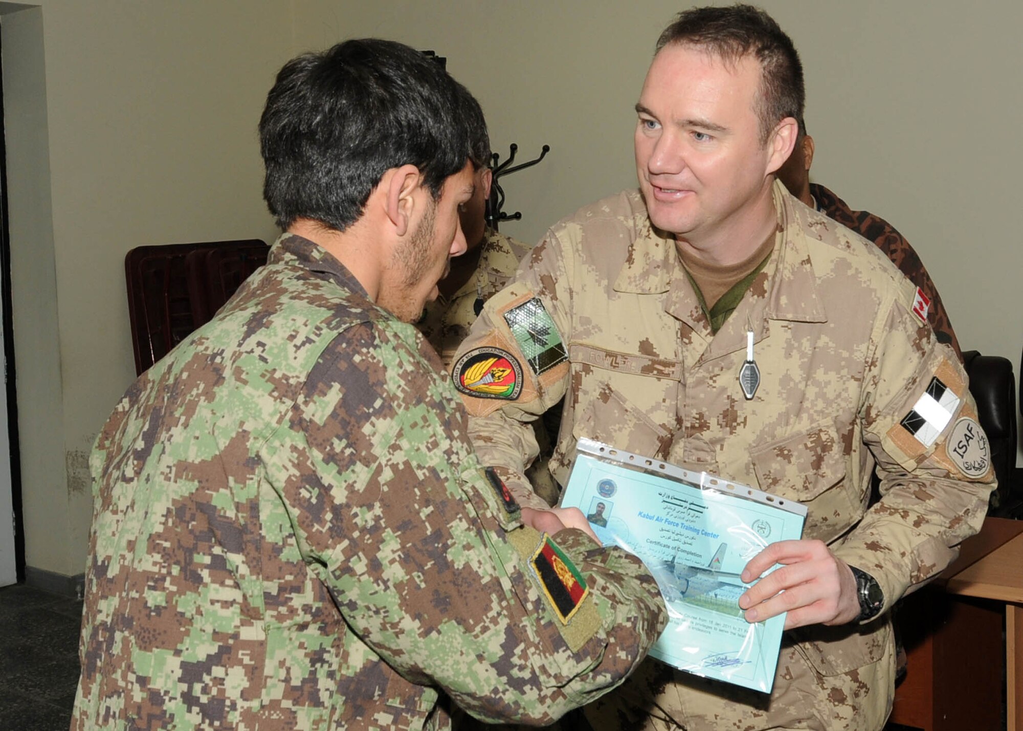 KABUL, Afghanistan - Thirteen members of the Afghan Air Force graduated from the Aerial Technical Instructor course and the C-27 Engine and Body course from Pohantoon-e-Hawayee, the Afghan Air Force's "Big Air School", on the Afghan Air Force base in Kabul, Afghanistan Mar. 3. (U.S. Navy photos by Mass Communications Specialist 3rd Class Jared E. Walker)