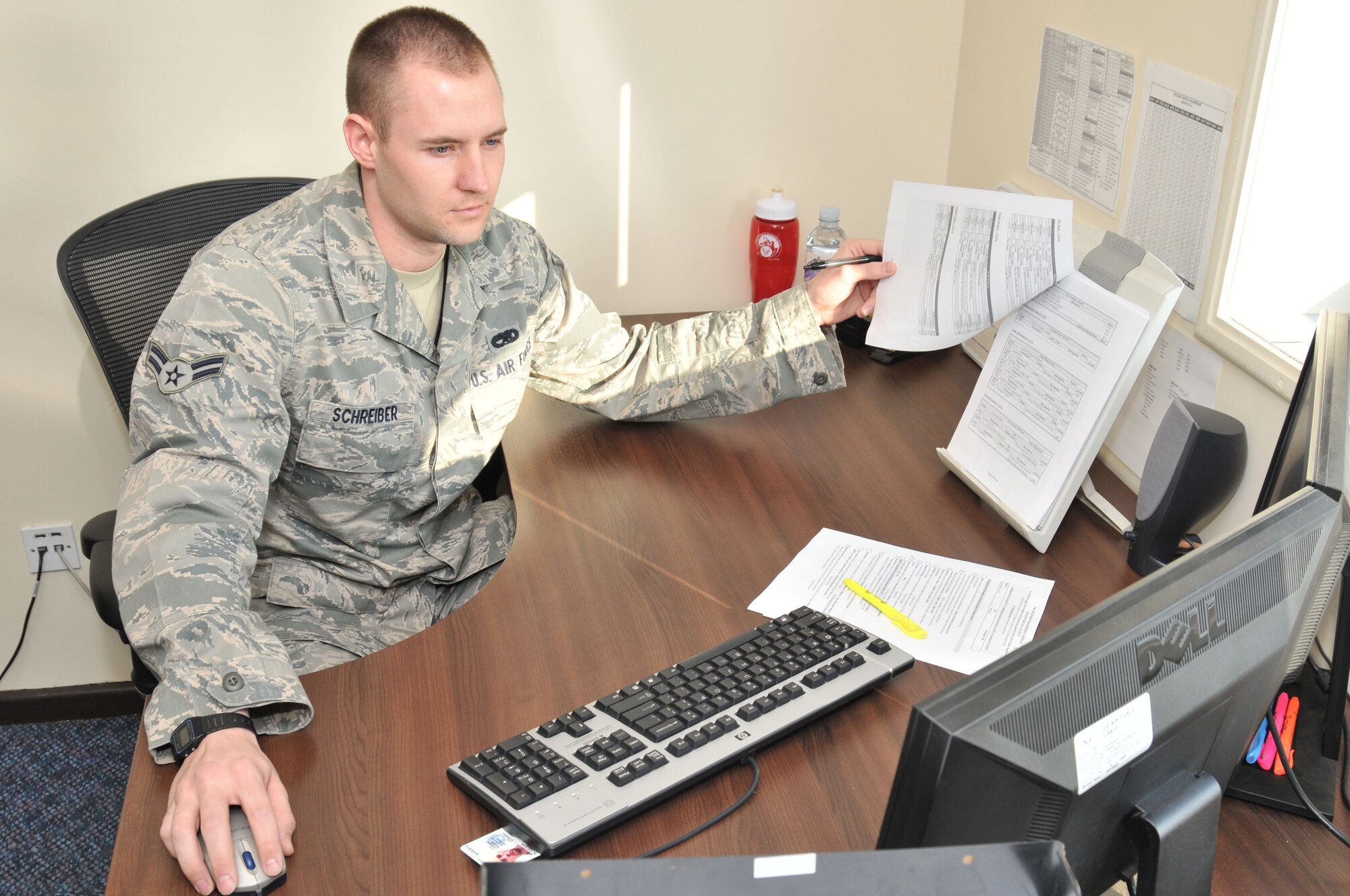 ROYAL AIR FORCE LAKENHEATH, England - Airman 1st Class Scott Schreiber, 48th Maintenance Operations Squadron dedicated maintenance analyst, tracks aircraft and maintenance actions, March 2. Airman Schreiber was nominated for a Liberty Spotlight because he demonstrates the core value of 'Excellence in All We Do.' (U.S. Air Force photo/Senior Airman David Dobrydney)